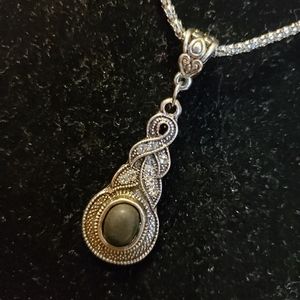 Silver tone necklace with rhinestone twist black onyx look stone